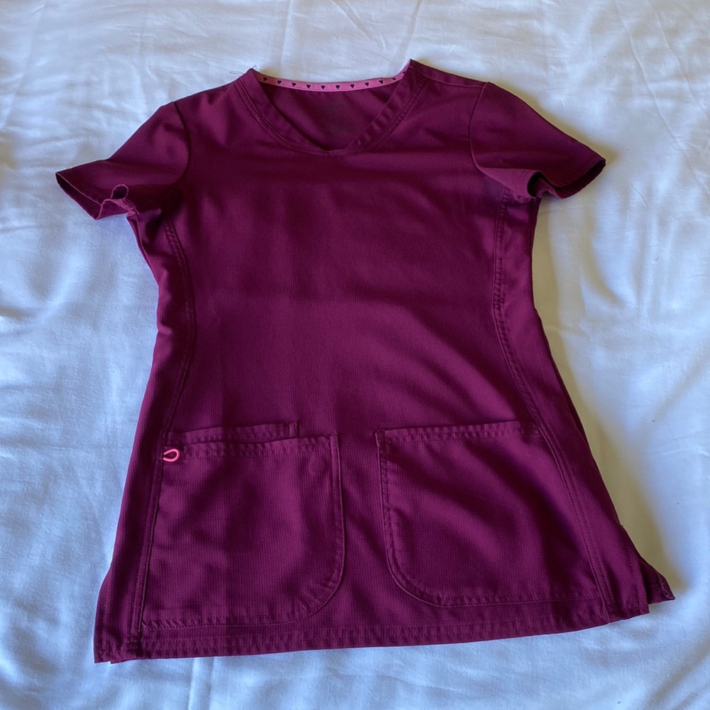 Maroon scrubs shirt and cuffed scrubs bottoms